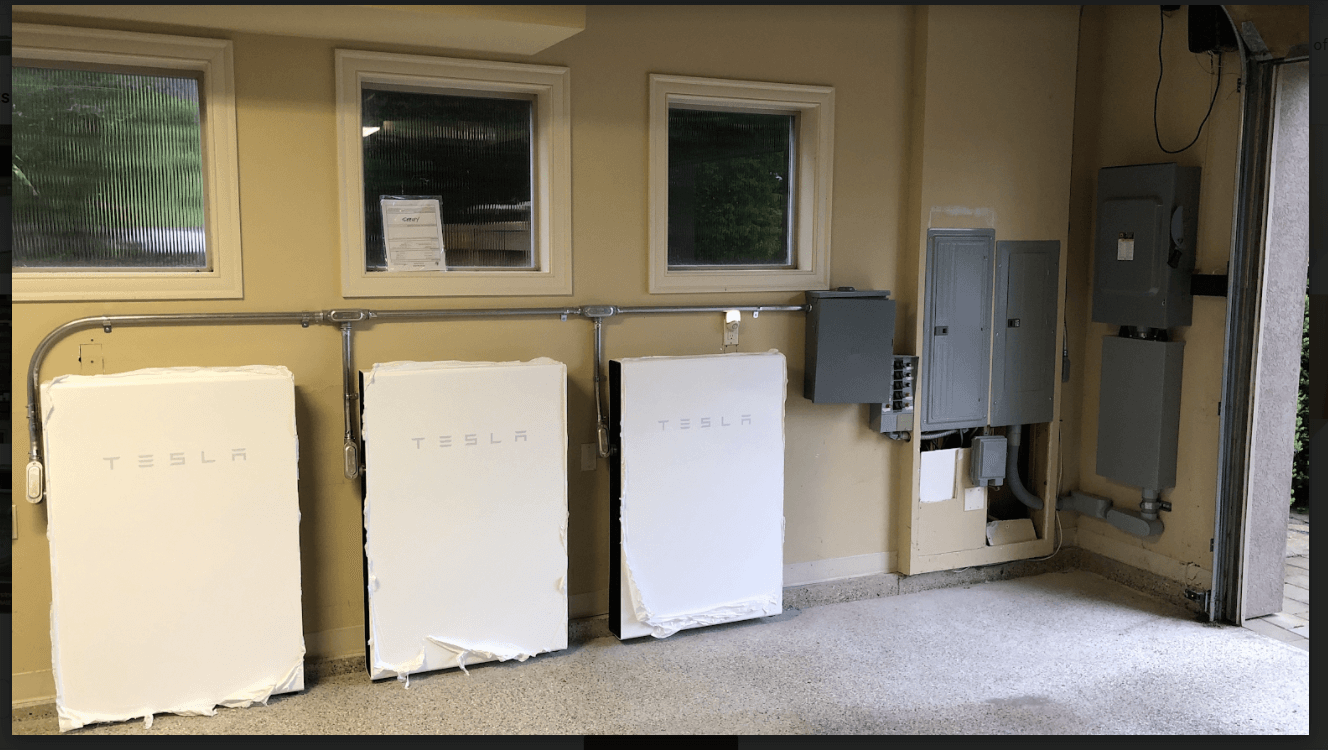 Residential Three Tesla Powerwall 2 system installed inside a garage,