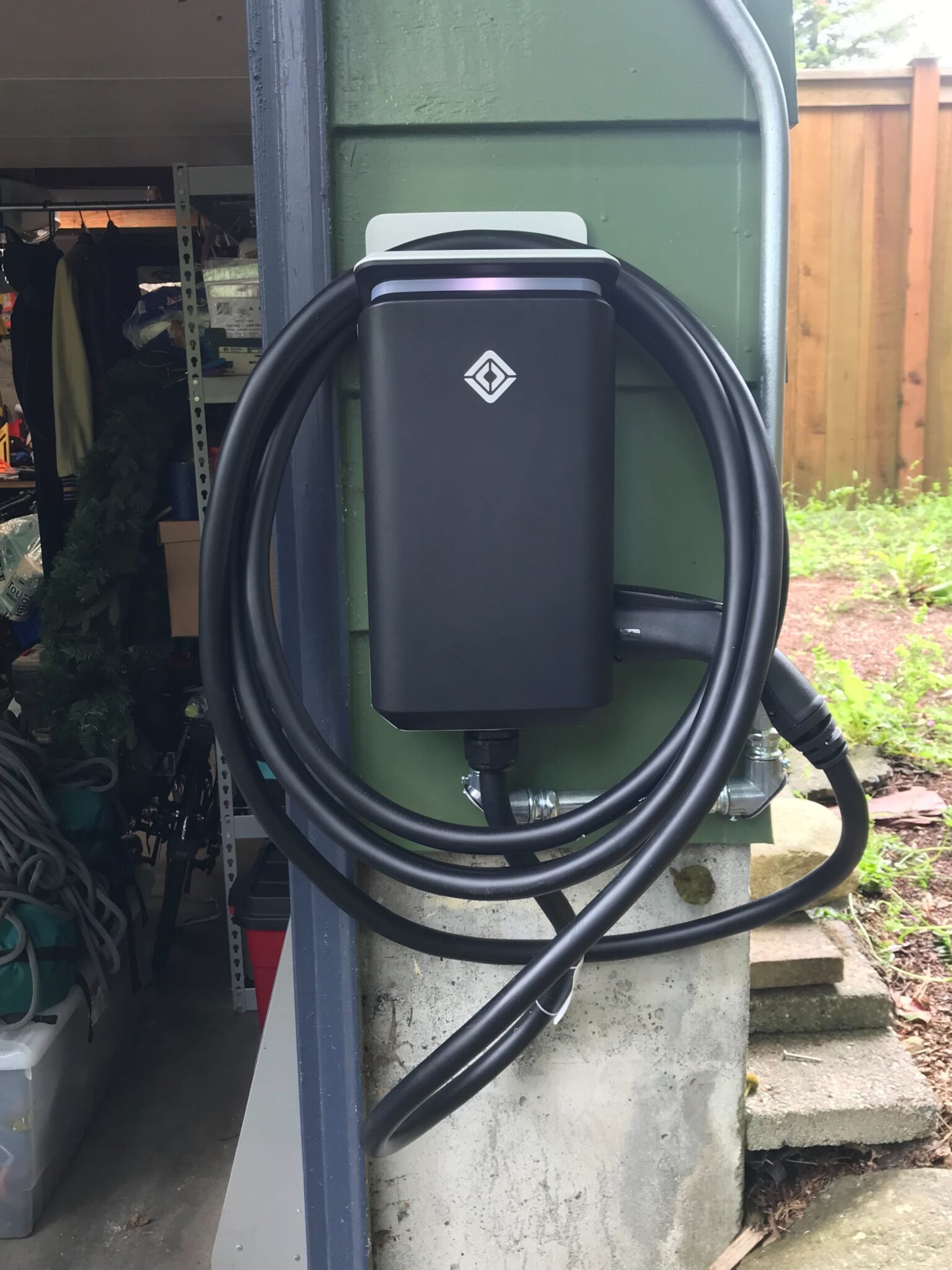 Rivian charger installed on side of garage