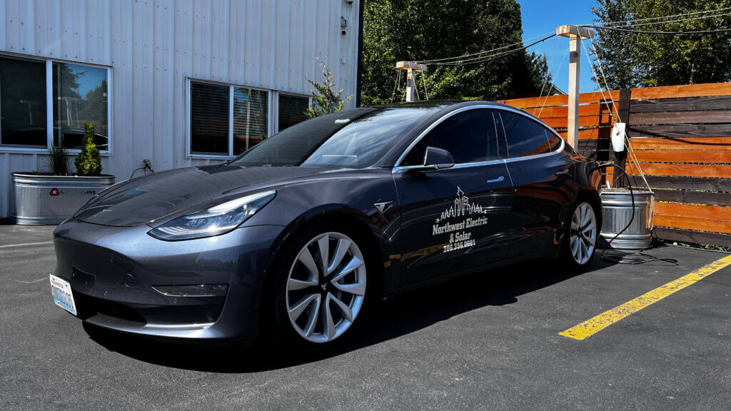 Northwest Electric and Solar Tesla Model S plugged into Tesla Wall Connector