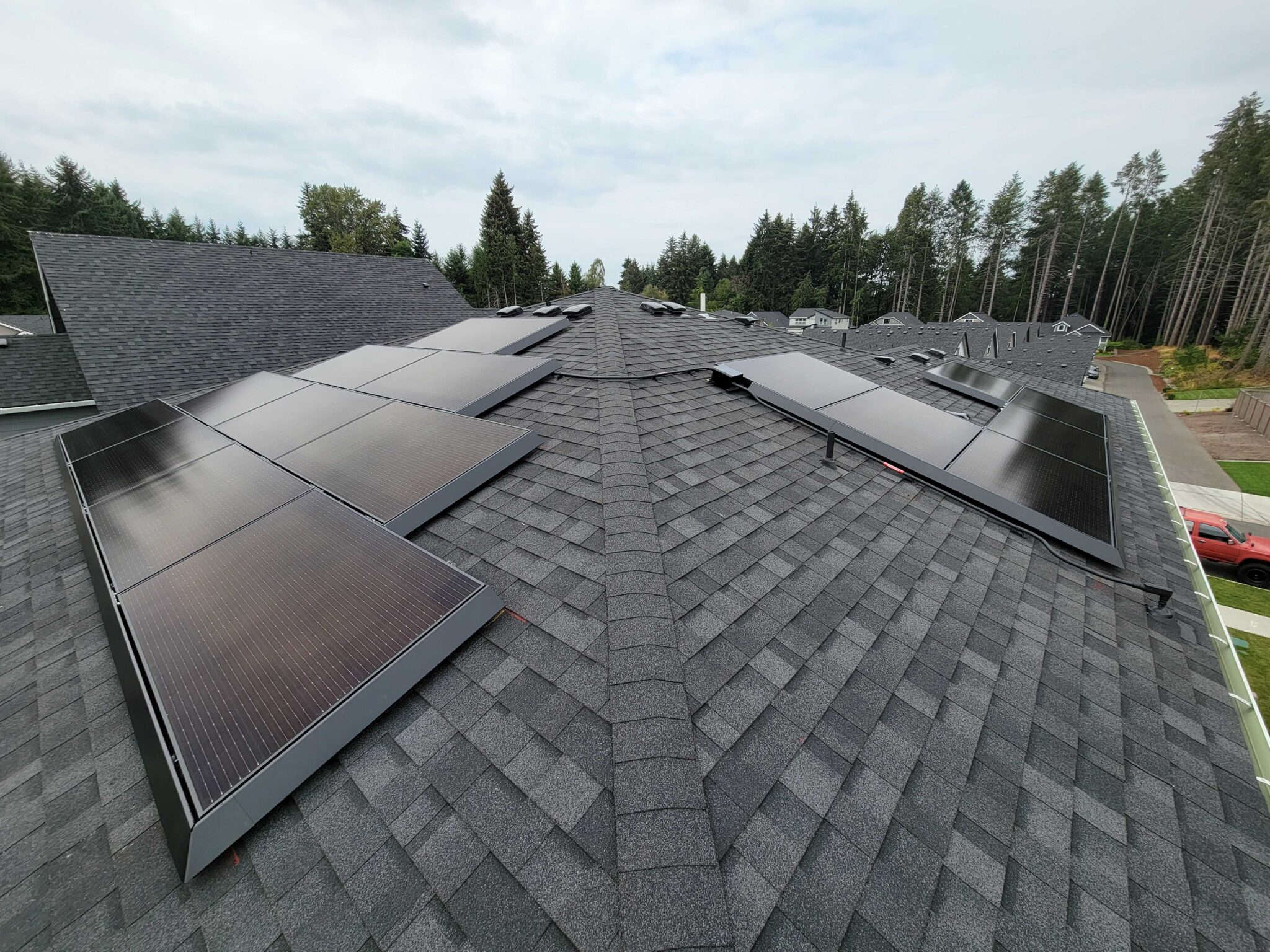 solar panels with electrical conduit pained black on residential rooftop solar system