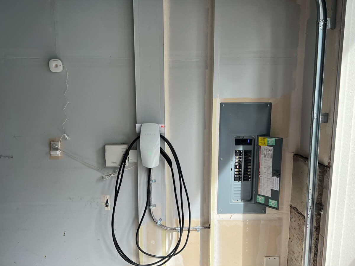 Tesla Wall Connector Installed by Electrical panel using flex conduit